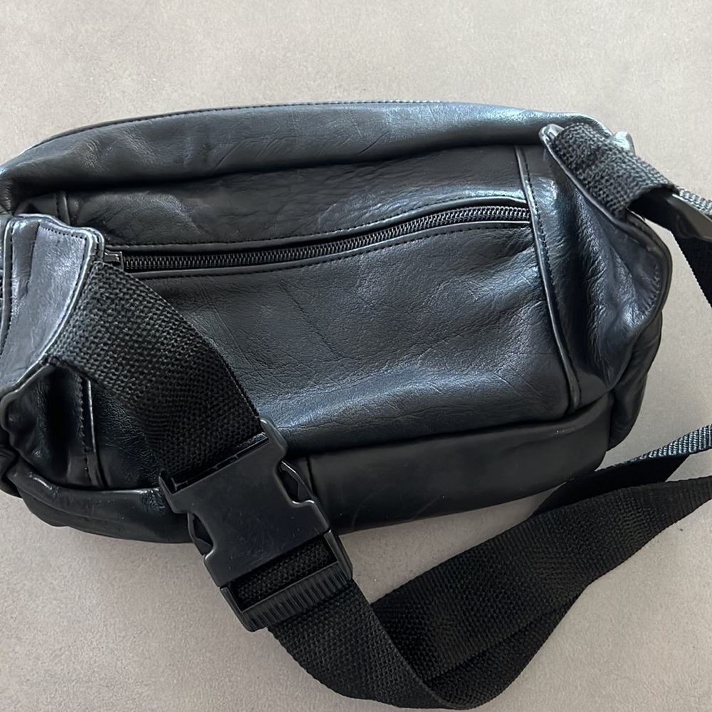 Like new black leather Fanny pack with multiple zippered compartments. - Picture 3 of 8
